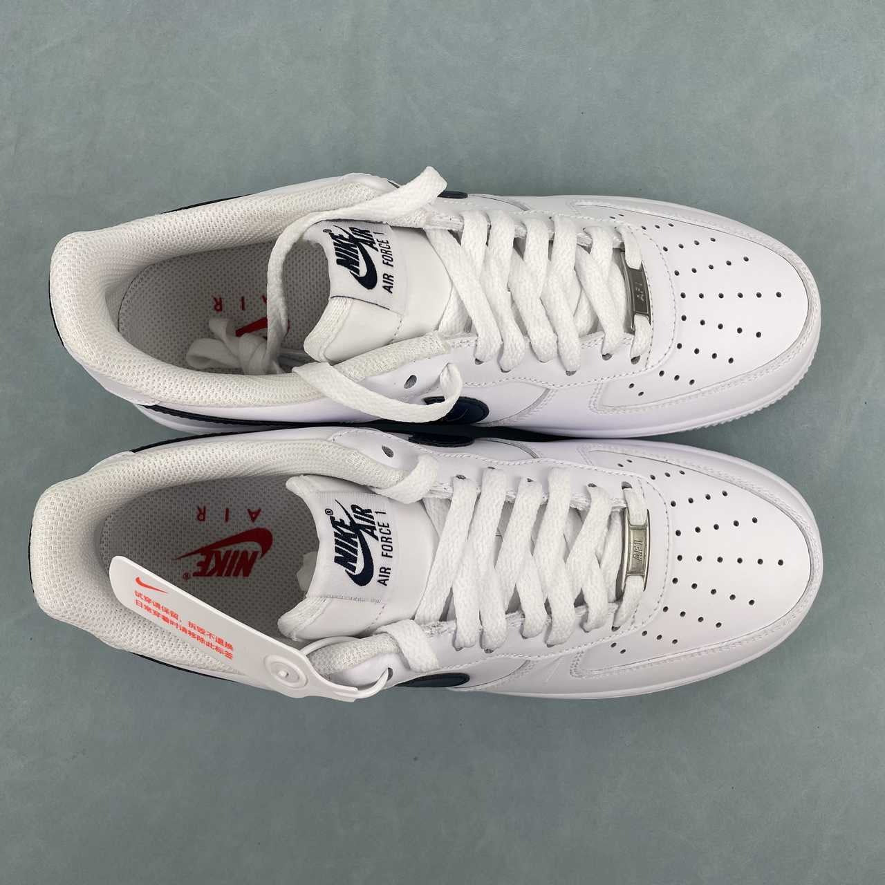 AF1-040 USA Soccer Tribute – pair lateral and front three-quarter view showing navy swoosh and white leather upper