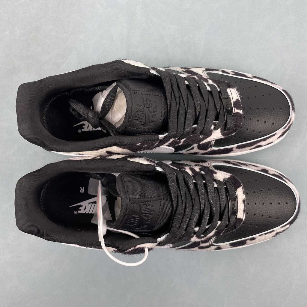 AF1-031 Cow Print Black/White – pair stacked on box, lateral and medial views