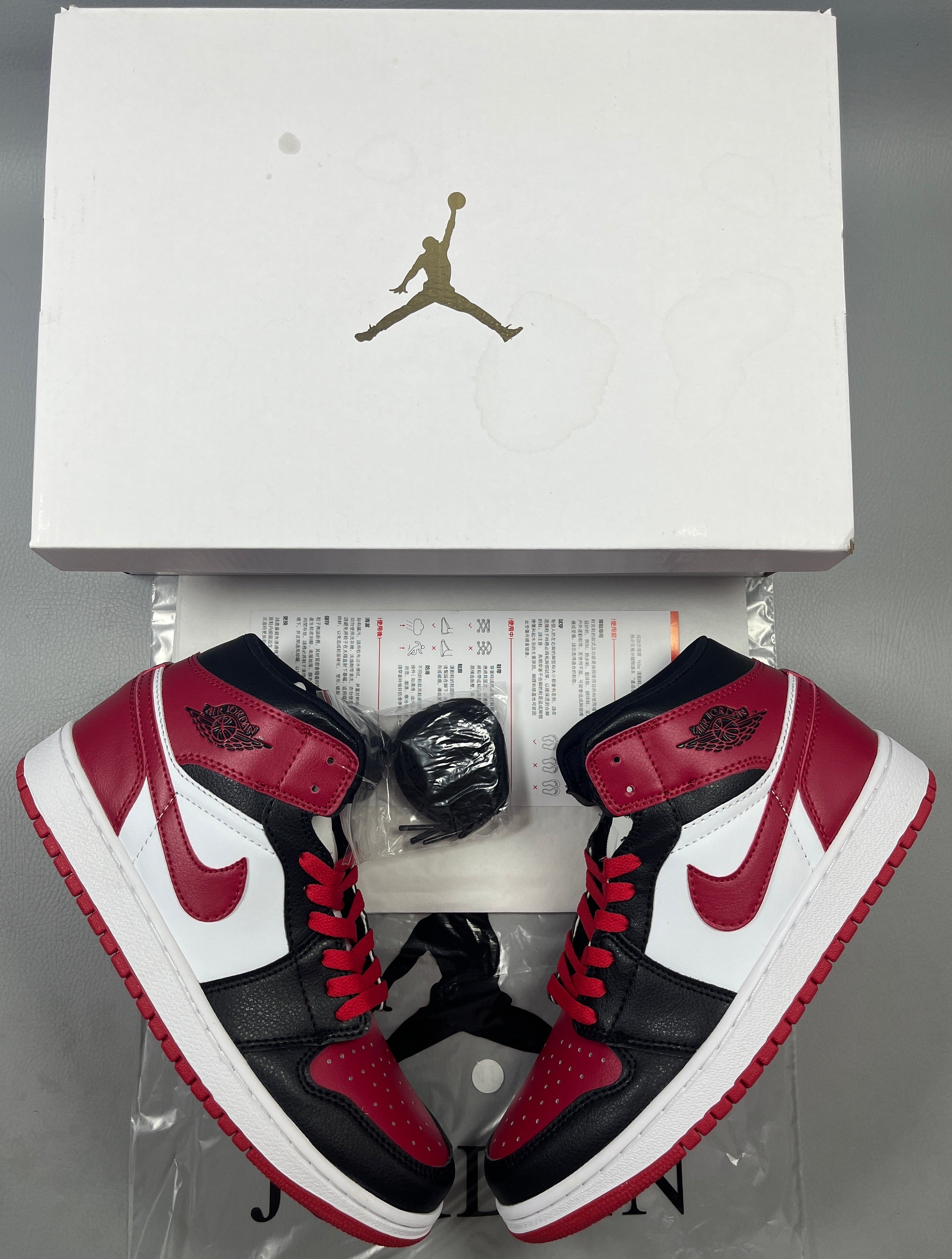 019 — Jordan 1 Mid “Bred Swoosh” — Design-Inspired Sneaker