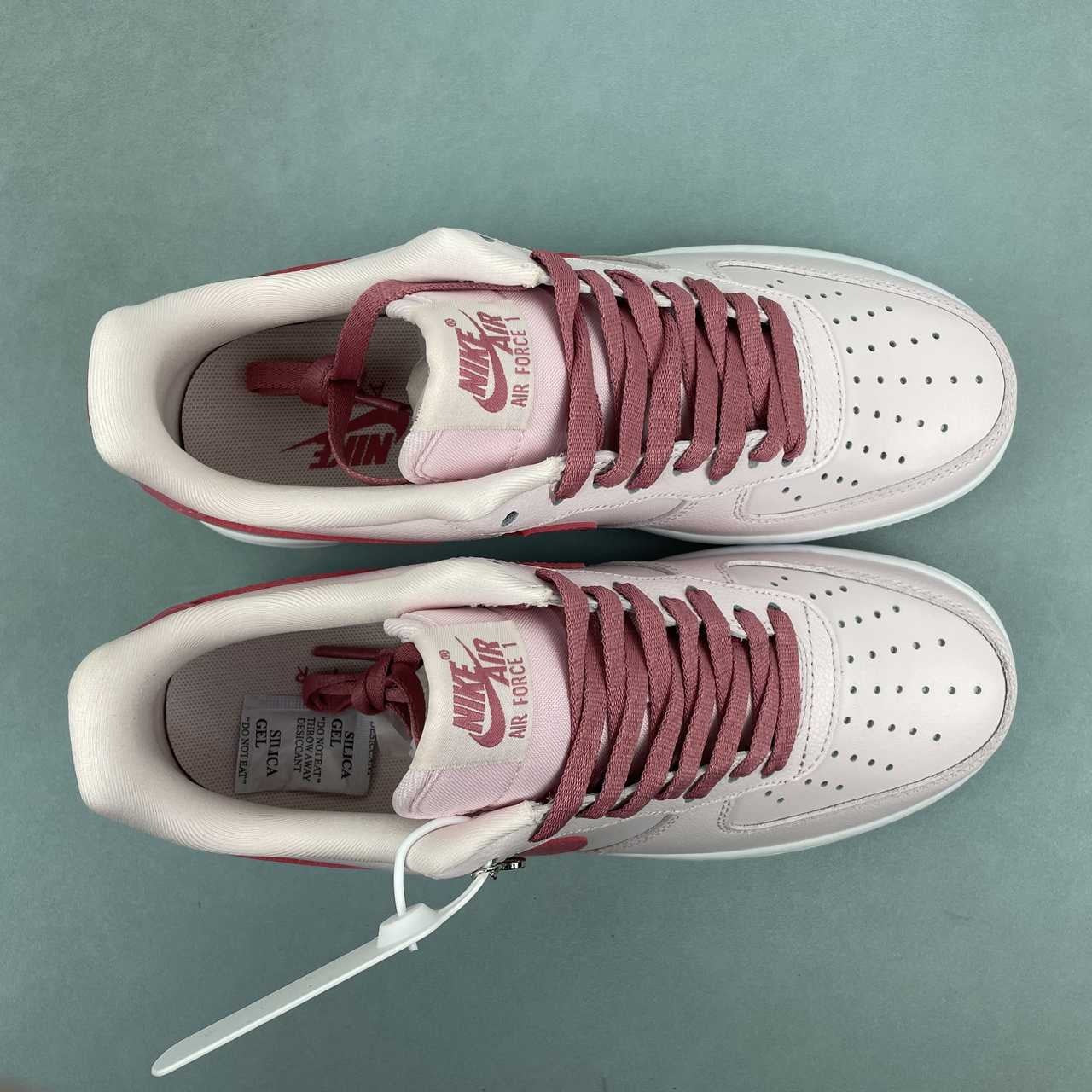 AF1-039 Love Letter Blush Burgundy – pair three-quarter view showing burgundy swoosh, blush upper, and heart charm detail