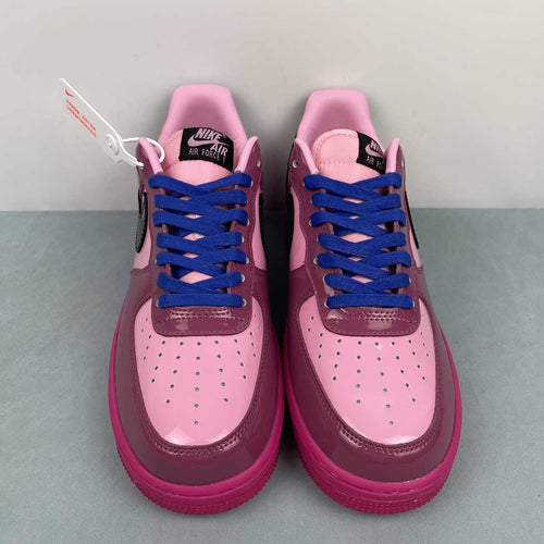 AF1-037 Berry Pink Patent – pair three-quarter front view showing light pink toe box, berry patent panels, black swoosh, and royal blue laces