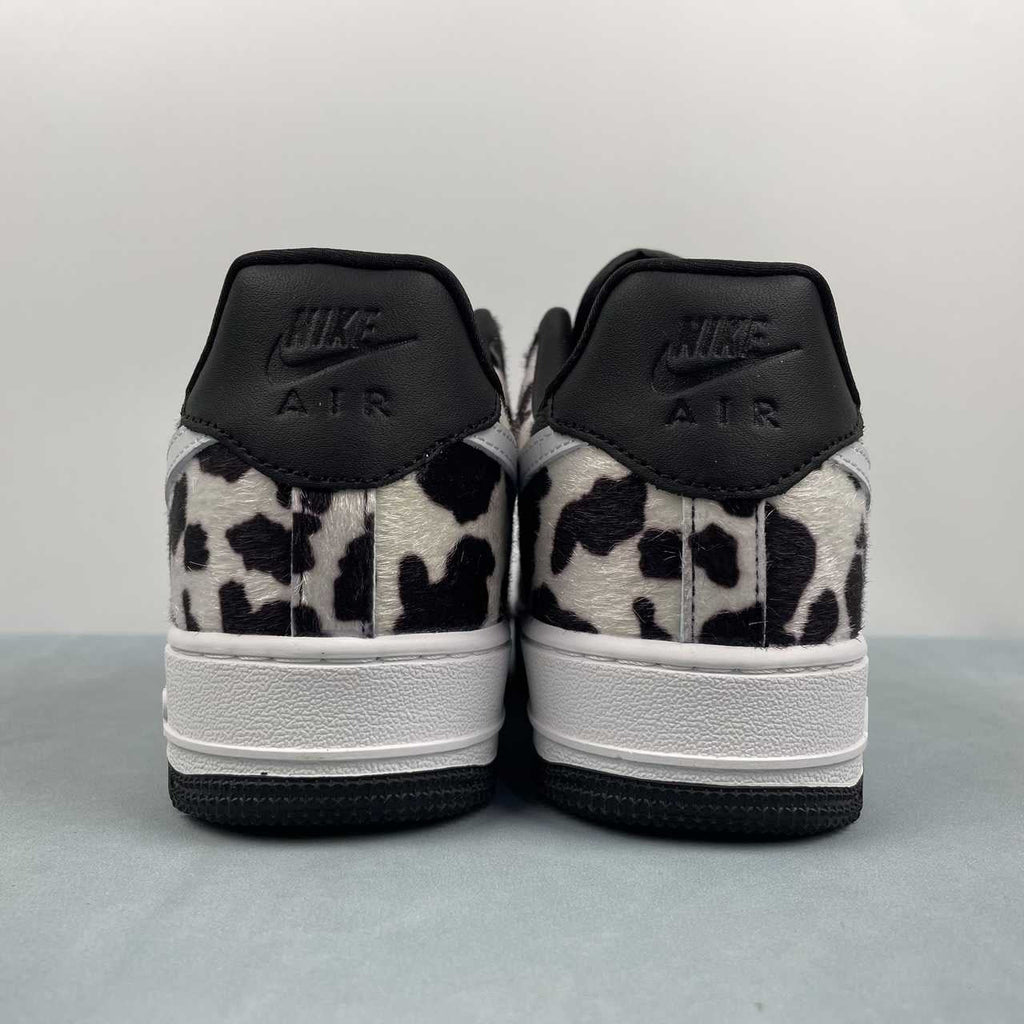 AF1-031 Cow Print Black/White – top-down pair view showing black laces and pony hair toe box