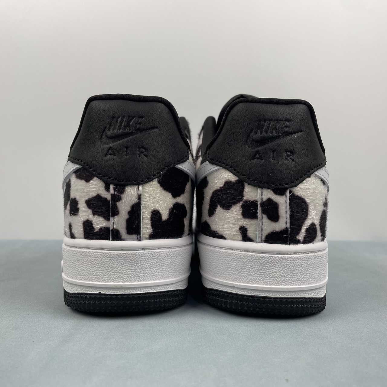 AF1-031 Cow Print Black/White – top-down pair view showing black laces and pony hair toe box