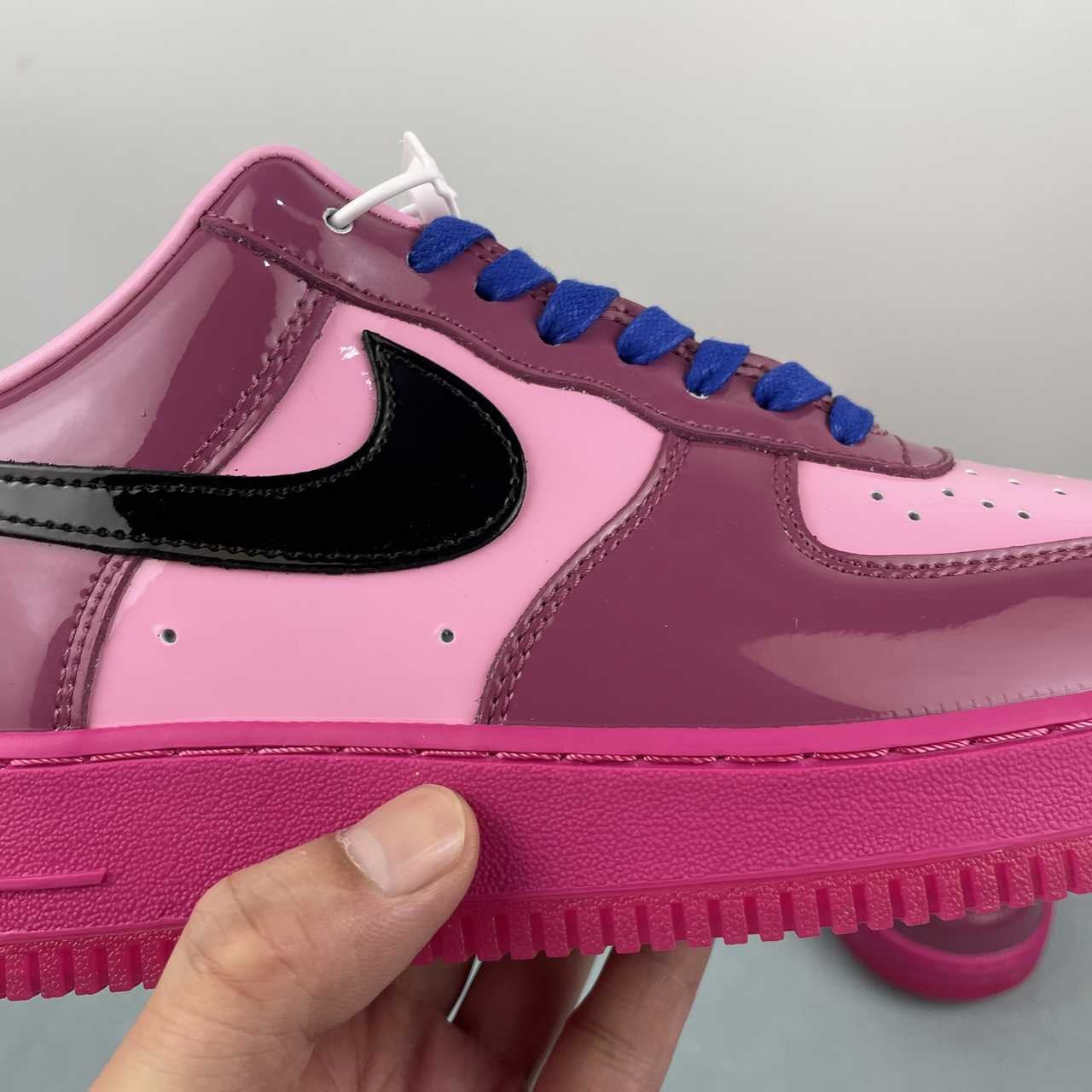 AF1-037 Berry Pink Patent – rear heel view showing black patent heel tab with pink NIKE AIR embroidery and fuchsia outsole